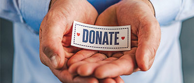 P2-Male-hands-donate-sign